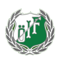 En logotyp med en sköld i grönt och vitt, omgiven av lagerblad.